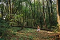 Girl standing in the woods portrait of a girl in the woods.bear