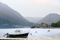 A girl stands on the background of the Bay of Kotor