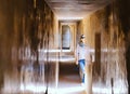 Girl stands in corridor on Amber Fort, Jaipur, India