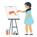 A girl stands in front of an easel and holds a brush in her hand. The child draws a picture.