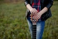 Girl stands with a guitar without playing, strings at rest, lay