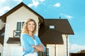 Girl stands in the street near her new house Royalty Free Stock Photo