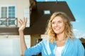 Girl stands in the street near her new house Royalty Free Stock Photo