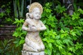 Girl statue in white stone in Balinese style