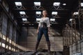 Girl in a steampunk costume at an abandoned factory