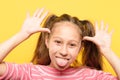 Girl sticking tongue grimacing childish behavior Royalty Free Stock Photo