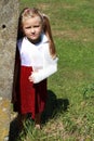Girl by the Stone Bollard Royalty Free Stock Photo