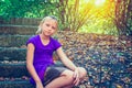 Girl on stone steps in the park