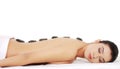 Girl on a stone therapy, hot stone massage