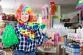 Girl in store of festival accessories Royalty Free Stock Photo