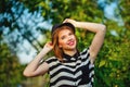 The girl straightens a hat. Royalty Free Stock Photo