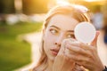 Girl straightens makeup on street Royalty Free Stock Photo