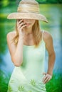 Girl in straw hat with phone Royalty Free Stock Photo