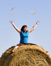 Girl on straw roll