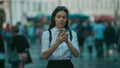 Girl on the street among the crowd of passers-by, photos in the style of surveillance