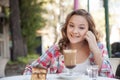 Girl in the street drink a capuccino Royalty Free Stock Photo