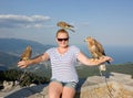 Young girl with birds of prey. Royalty Free Stock Photo