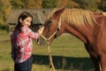 Girl Strokes A Horse Royalty Free Stock Photo