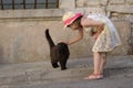 Girl stroking cat