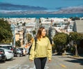 Girl strolls through the steep streets of San Francisco during her USA vacation