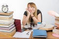 Girl student fell asleep at table drinking three cups of coffee