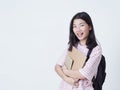 Girl student holding books with backpacks