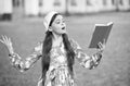 Girl student reading book outdoors, recite poetry concept Royalty Free Stock Photo