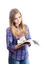 Girl student reading a book on a white background.