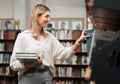 Girl, student and search books in library for education, knowledge and learning. Happy young woman at university Royalty Free Stock Photo