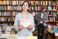 girl student standing in bookshop Royalty Free Stock Photo