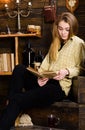 Girl student study with book in house of gamekeeper. Study concept. Girl in casual outfit sits with book in wooden