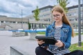 Girl student teenager outdoor near school building