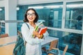 Student with work books in the classroom for lectures at the University. Concept of teaching and learning