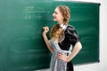 Girl student write some math equation at blackboard Royalty Free Stock Photo