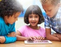 Girl, students learning and tablet in classroom for online education, teaching and information in portrait. Young kids Royalty Free Stock Photo