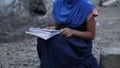 A girl studying in IDP camps from