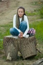 Girl on stump Royalty Free Stock Photo