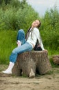 Girl on stump Royalty Free Stock Photo