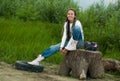 Girl on stump Royalty Free Stock Photo
