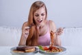 Girl suffering from bulimia eats dinner Royalty Free Stock Photo