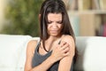 Girl suffering skin irritation scratching arm Royalty Free Stock Photo