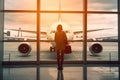 Girl with suitcase at airport window Royalty Free Stock Photo