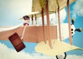 Girl with suitcase flying vintage plane