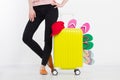 Girl with suitcase isolated on white background .Summer holidays. summer flip flops or slippers. Travel valise or bag. Mock up. Co Royalty Free Stock Photo