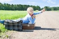 Girl with suitcase standing about road Royalty Free Stock Photo