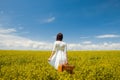 Girl with suitcase at wheat field Royalty Free Stock Photo