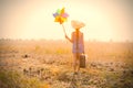 Girl with suitcase and wind toy Royalty Free Stock Photo