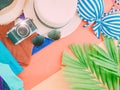 Girl summer cloth accessorie with palm leaf , camera and beach h Royalty Free Stock Photo