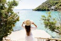 Girl in summer dress and hat on beach Royalty Free Stock Photo