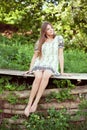 Girl in a summer dress sitting and relaxing